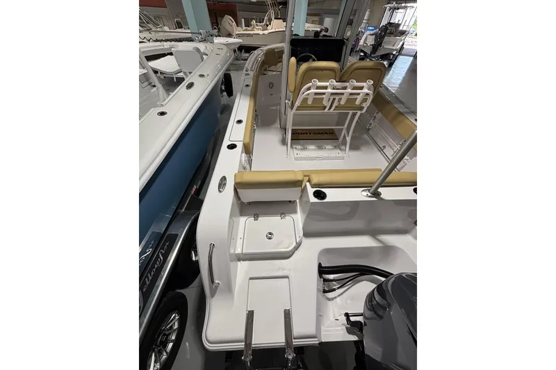Slide: The Image of 2027 Sportsman Heritage 231 Center Console boat interior with seating and controls. - 21