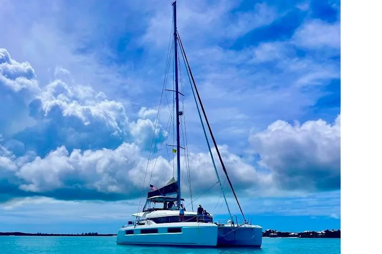 The Image of 2021 Lagoon 50 catamaran sailing on turquoise waters under a vibrant blue sky. - 0