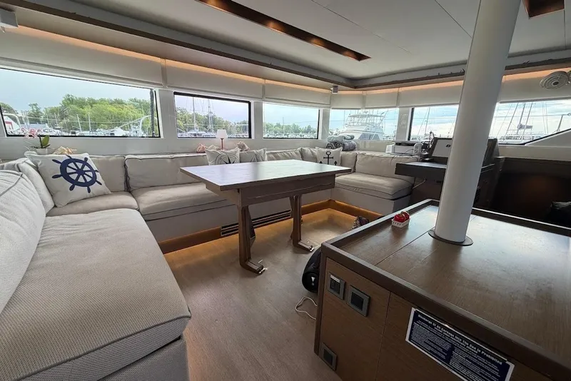 Slide: The Image of Luxurious interior of 2021 Lagoon 50 yacht with spacious seating and modern decor. - 14