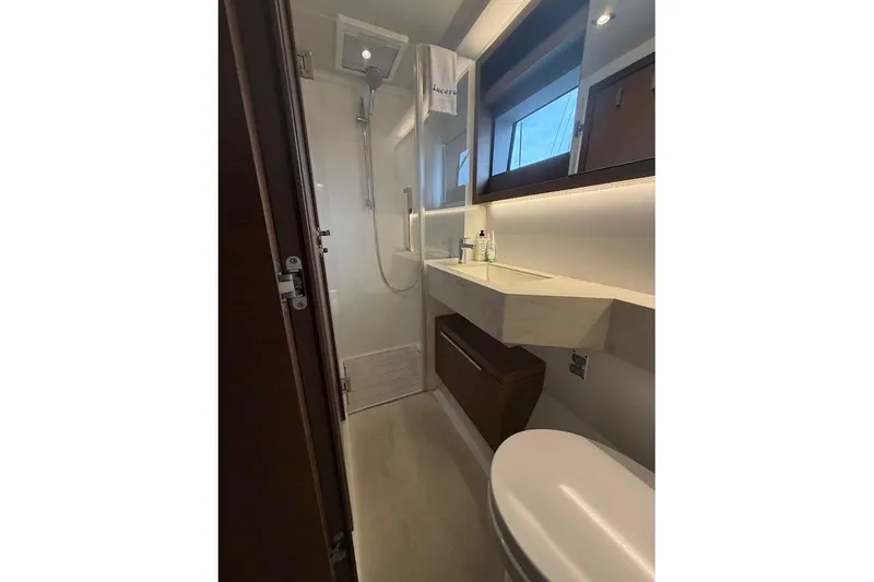 Slide: The Image of Modern bathroom interior on a 2021 Lagoon 50 yacht, featuring sleek fixtures and ample lighting. - 17