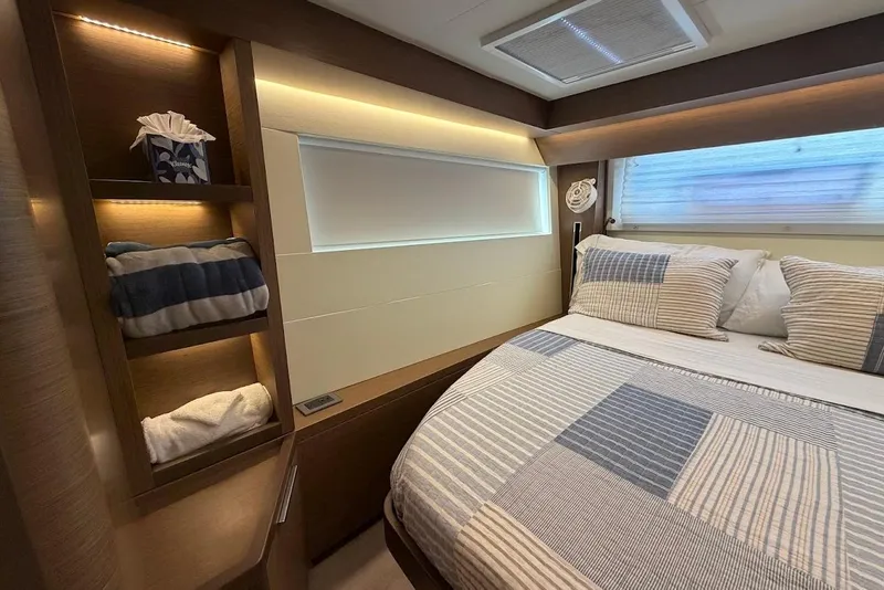 Slide: The Image of Luxurious cabin interior of 2021 Lagoon 50 yacht with cozy bedding and ambient lighting. - 19