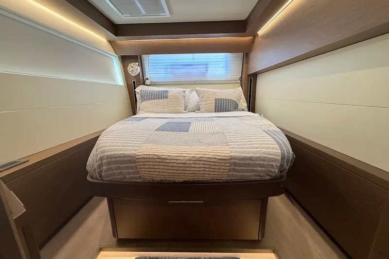 Slide: The Image of Luxurious bedroom interior of 2021 Lagoon 50 yacht with modern design and cozy bedding. - 20