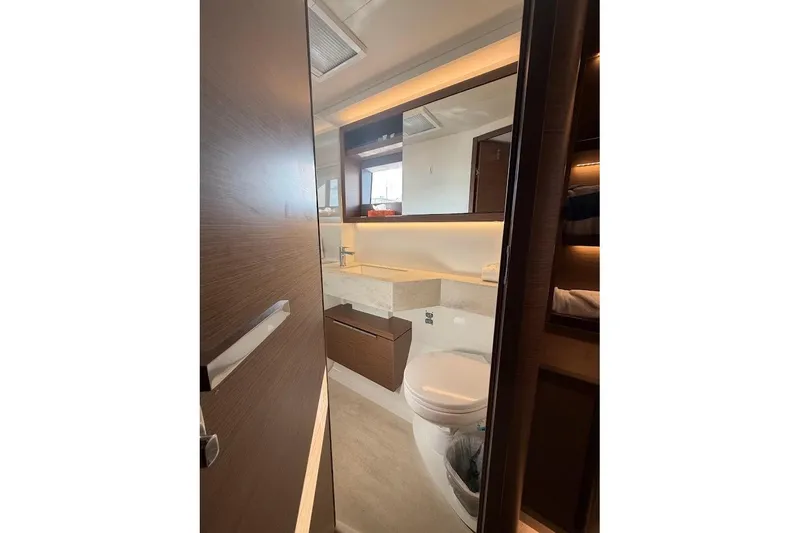 Slide: The Image of Modern bathroom interior on 2021 Lagoon 50 yacht, featuring sleek design and wood accents. - 21
