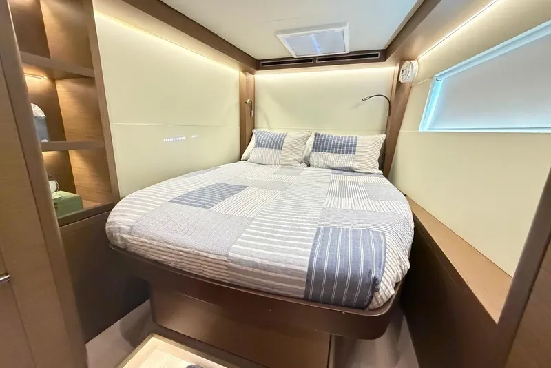 Slide: The Image of Luxurious cabin interior of 2021 Lagoon 50 yacht with cozy bed and modern design. - 23