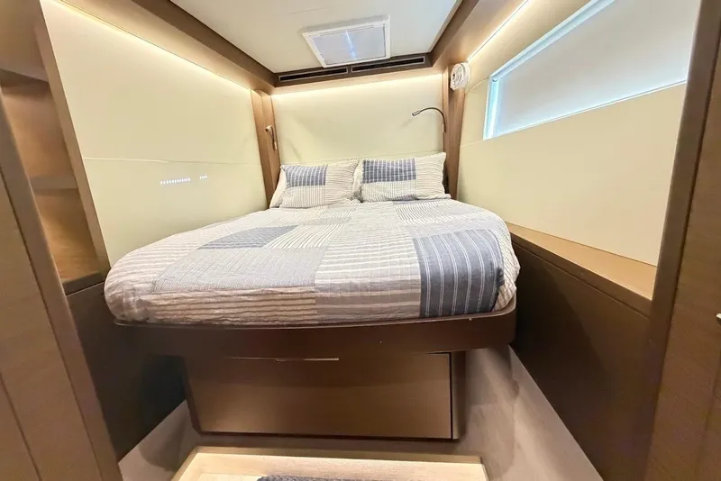 Slide: The Image of Luxurious cabin interior of 2021 Lagoon 50 yacht with cozy bed and modern design. - 24