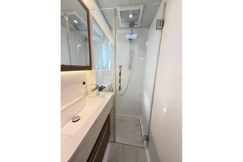 Slide: The Image of Modern bathroom in 2021 Lagoon 50 yacht with sleek shower and vanity. - 26