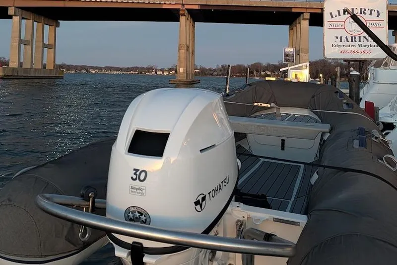 Slide: The Image of Tohatsu outboard motor on a Lagoon 50 yacht, docked at Liberty Marina, Edgewater, Maryland. - 33