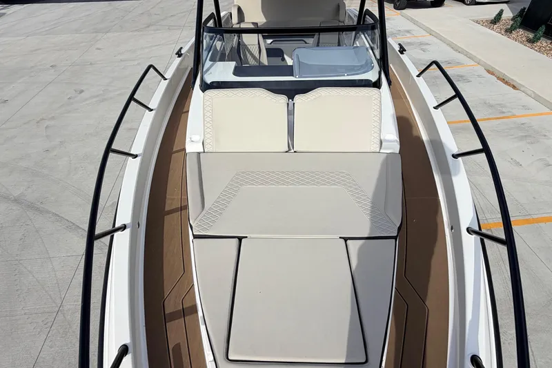 Slide: The Image of 2026 Navan S30 boat with spacious deck and cushioned seating. - 14