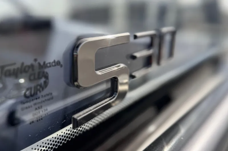 Slide: The Image of Close-up of 2026 Navan S30 logo on a reflective surface. - 24