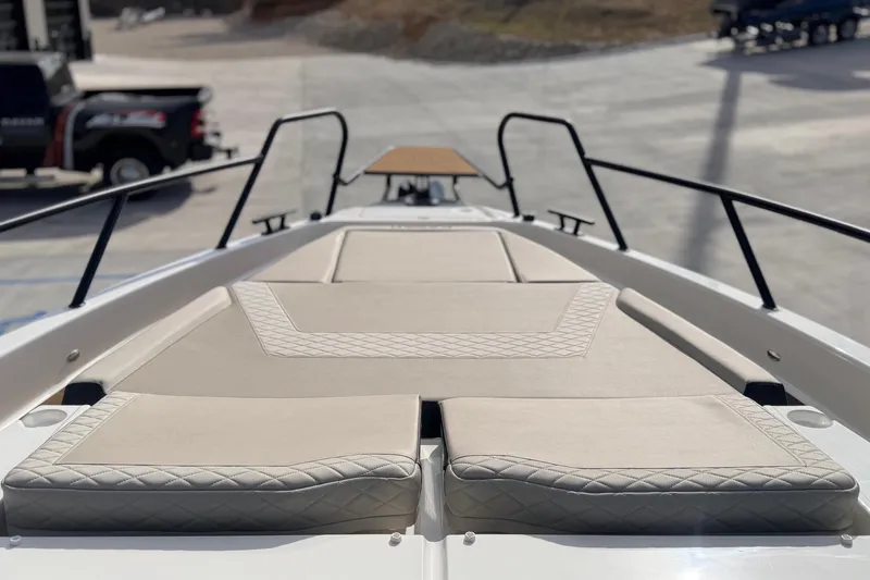 Slide: The Image of Luxurious deck of 2026 Navan S30 boat with beige cushioned seating. - 28