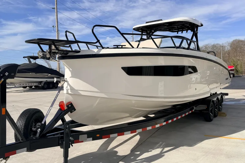 Slide: The Image of 2026 Navan S30 boat on trailer in outdoor setting, showcasing sleek design. - 3