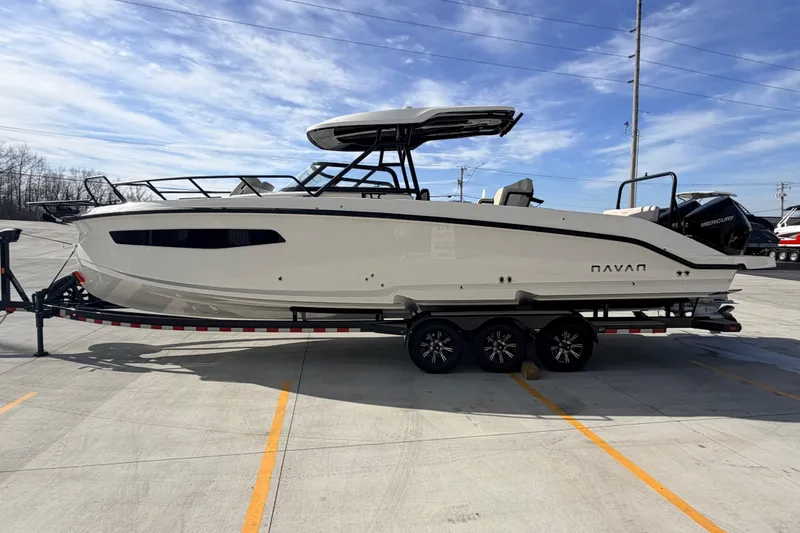 Slide: The Image of 2026 Navan S30 boat on trailer under clear blue sky. - 5