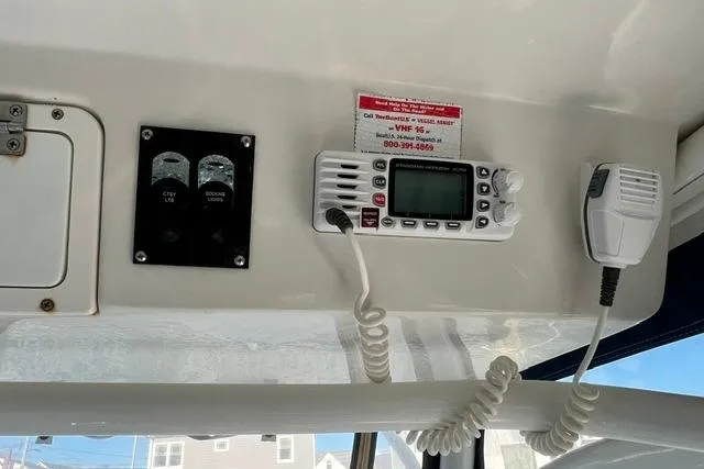 Slide: The Image of 2014 Sailfish 270 CC boat interior with radio and control panel. - 5
