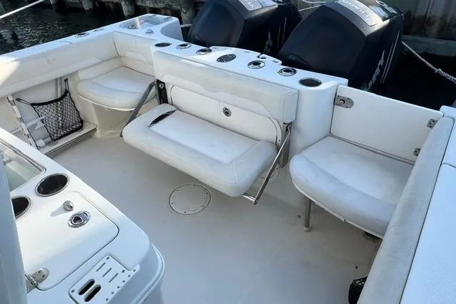 Slide: The Image of 2014 Sailfish 270 CC boat interior with seating and storage compartments. - 7