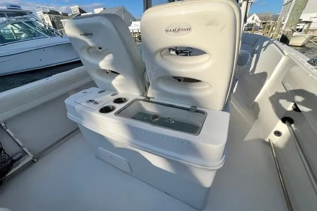 Slide: The Image of 2014 Sailfish 270 CC boat interior with seating and storage compartments. - 8