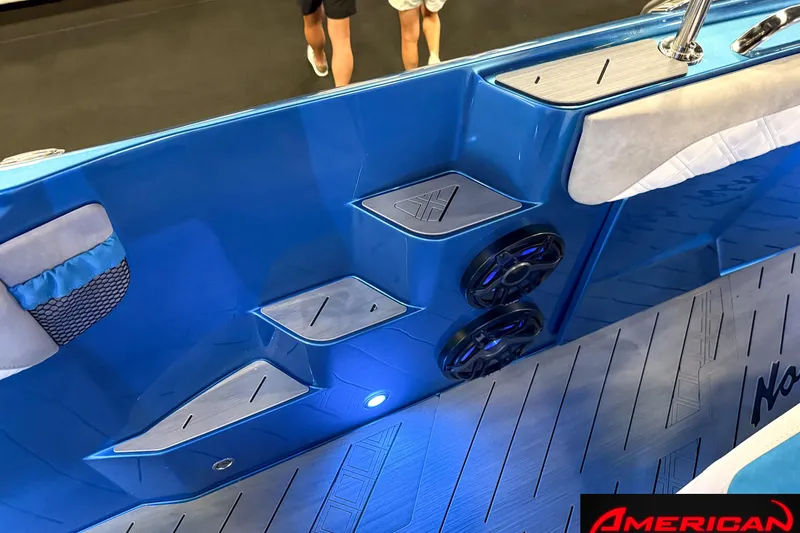 Slide: The Image of Blue interior of 2027 Nor-Tech 42 Eleven boat with speakers and seating. - 10