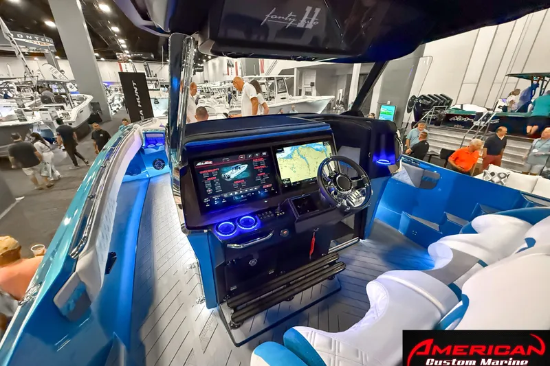 Slide: The Image of 2027 Nor-Tech 42 Eleven boat interior with advanced navigation system at a marine exhibition. - 11