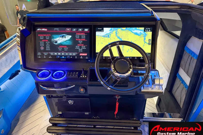 Slide: The Image of Cockpit of 2027 Nor-Tech 42 Eleven with advanced navigation and control systems. - 12