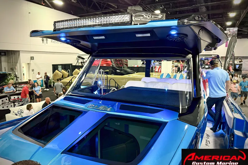 Slide: The Image of 2027 Nor-Tech 42 Eleven boat showcased at an indoor marine exhibition by American Custom Marine. - 14