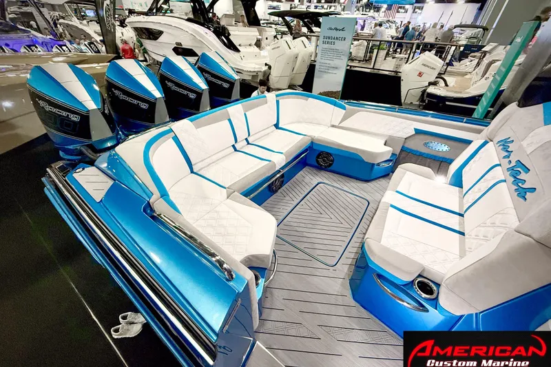 Slide: The Image of Luxurious 2027 Nor-Tech 42 Eleven boat interior with plush seating and powerful outboard engines. - 4