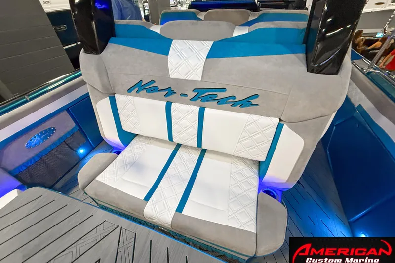 Slide: The Image of Luxurious seating in the 2027 Nor-Tech 42 Eleven boat, featuring custom upholstery and ambient lighting. - 6