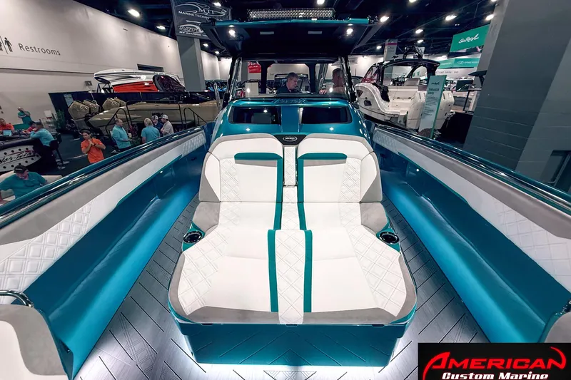 Slide: The Image of 2027 Nor-Tech 42 Eleven boat interior at a marine exhibition, featuring sleek seating design. - 7
