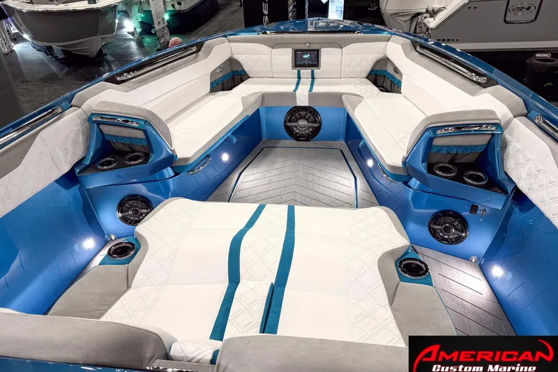 Slide: The Image of Luxurious interior of 2027 Nor-Tech 42 Eleven boat with white and blue seating. - 8