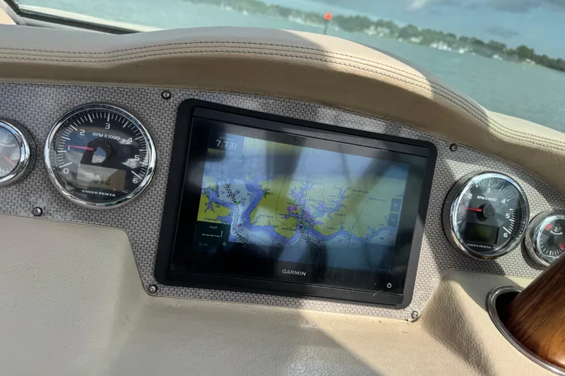 Slide: The Image of Dashboard of a 2013 Regal 3200 Bowrider with Garmin navigation display. - 12