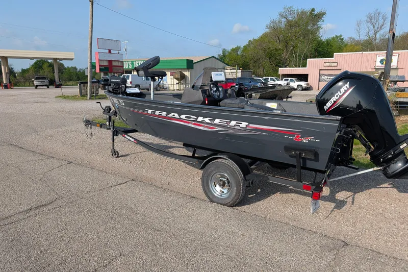 Slide: The Image of 2022 Tracker Pro Guide V-16 SC boat on trailer in parking lot. - 74