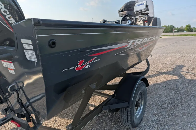 Slide: The Image of 2022 Tracker Pro Guide V-16 SC boat on trailer, side view with graphics. - 77