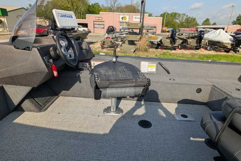 Slide: The Image of 2022 Tracker Pro Guide V-16 SC boat interior with steering console and seating. - 86