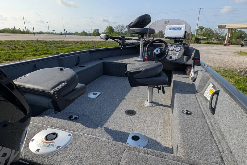 Slide: The Image of 2022 Tracker Pro Guide V-16 SC boat interior with seating and control panel. - 88