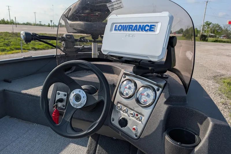 Slide: The Image of 2022 Tracker Pro Guide V-16 SC boat dashboard with Lowrance HDS display and steering wheel. - 92