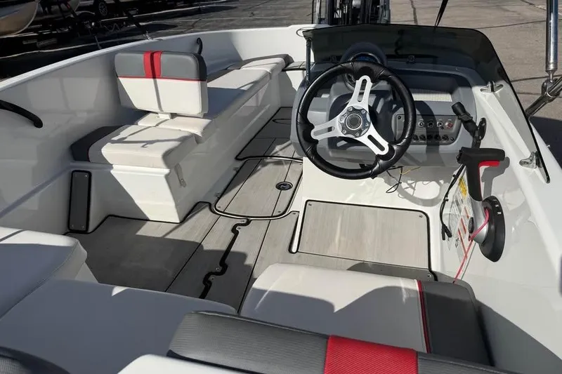 Slide: The Image of 2020 Tahoe T16 boat interior with steering wheel and seating arrangement. - 10