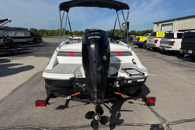 Slide: The Image of 2020 Tahoe T16 boat with outboard motor on trailer in parking lot. - 6
