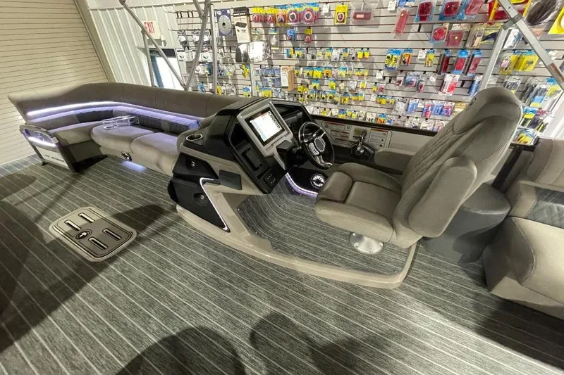 Slide: The Image of 2024 Premier 270 Intrigue boat interior with modern dashboard and seating. - 12
