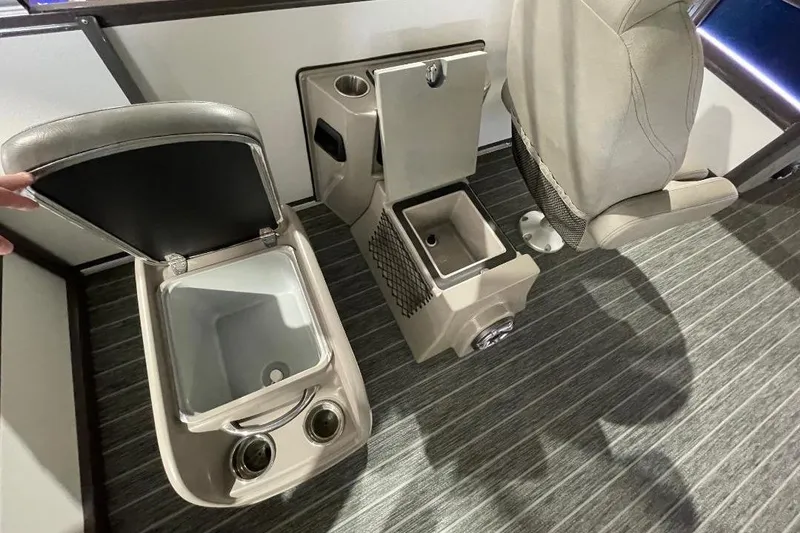 Slide: The Image of 2024 Premier 270 Intrigue interior with open storage compartments and seating. - 14