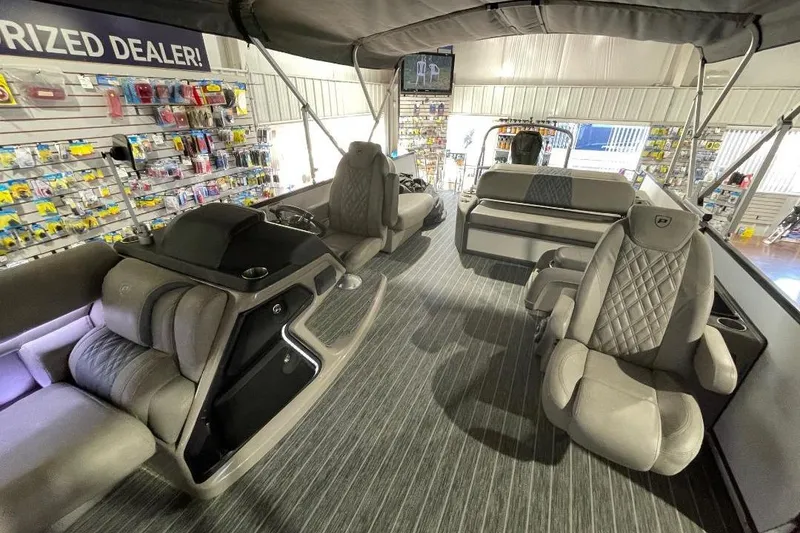 Slide: The Image of Luxurious interior of 2024 Premier 270 Intrigue pontoon boat with plush seating and modern design. - 15