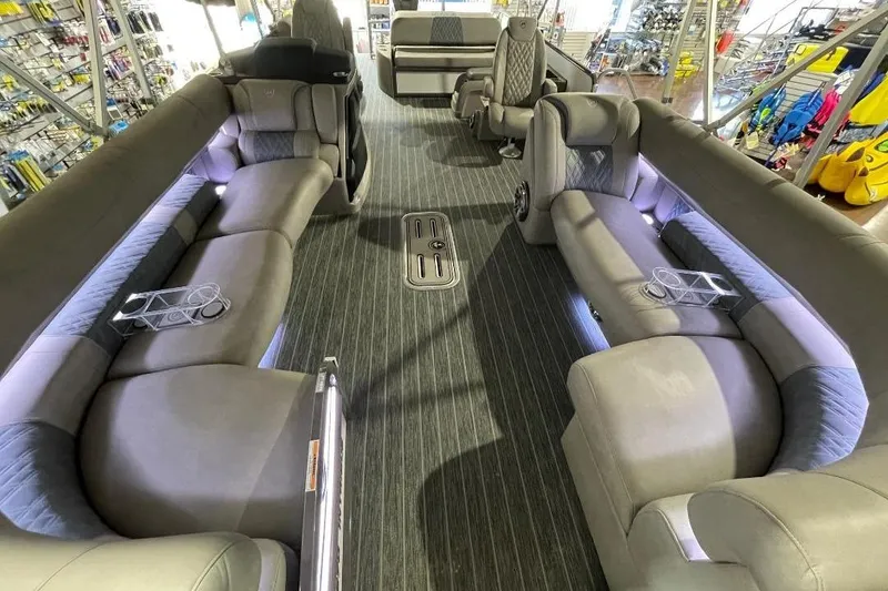 Slide: The Image of Luxurious interior of 2024 Premier 270 Intrigue pontoon boat with plush seating. - 17