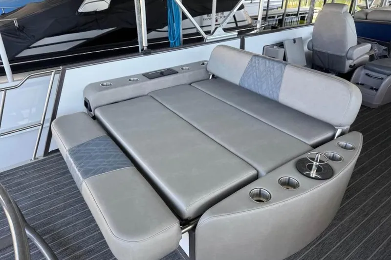Slide: The Image of Luxurious seating area on 2024 Premier 270 Intrigue boat with cup holders. - 6