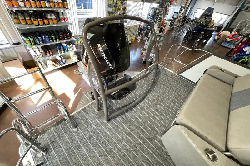 Slide: The Image of 2024 Premier 270 Intrigue boat interior with Mercury engine and accessories display. - 9