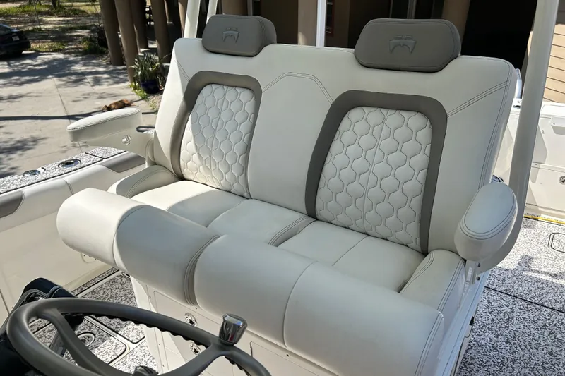 Slide: The Image of Luxurious seating on 2018 World Cat 320 CC boat, featuring elegant upholstery and modern design. - 16