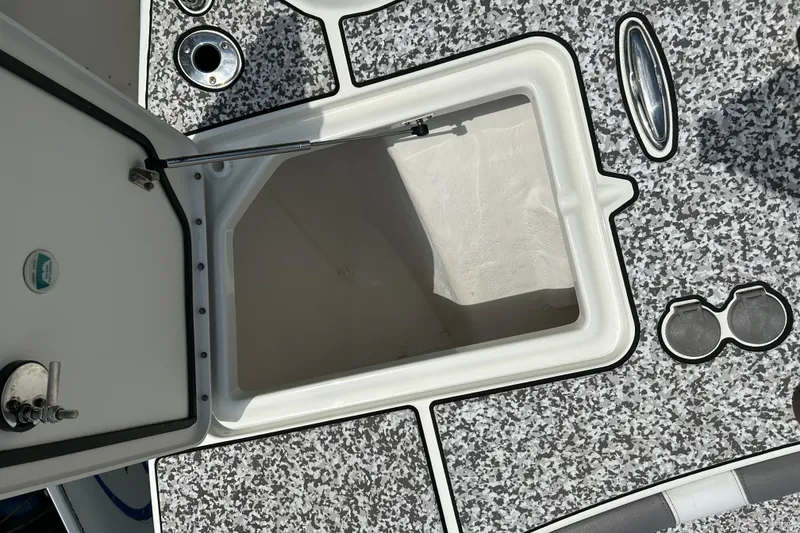 Slide: The Image of Open storage compartment on 2018 World Cat 320 CC boat deck. - 25