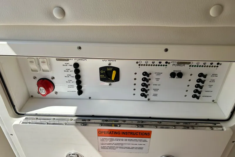 Slide: The Image of Control panel of a 2018 World Cat 320 CC boat with operating instructions. - 9