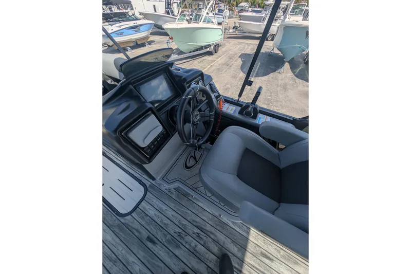 Slide: The Image of Interior of 2025 Veranda Relax VR 22 RC boat with steering wheel and dashboard. - 6