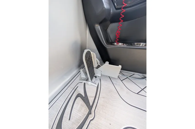 Slide: The Image of Foot pedal and cup holders in 2025 Veranda Relax VR 22 RC boat interior. - 7
