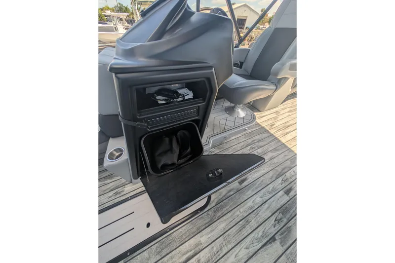 Slide: The Image of 2025 Veranda Relax VR 22 RC boat interior with open storage compartment and seating. - 8