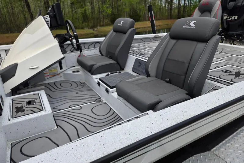 Slide: The Image of 2021 Xpress X21 Pro boat interior with sleek seating and modern design. - 11