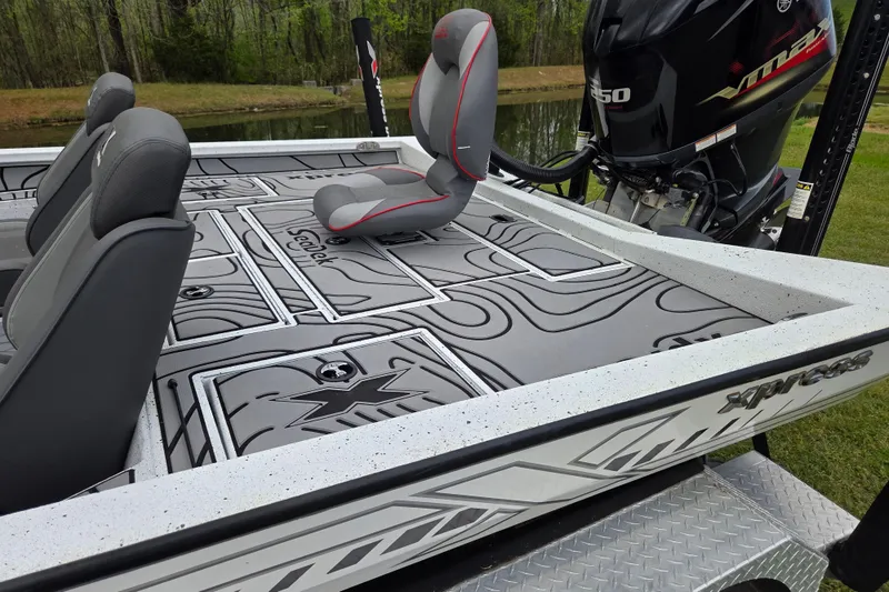 Slide: The Image of 2021 Xpress X21 Pro boat with Yamaha VMAX engine, featuring sleek seating and deck design. - 12