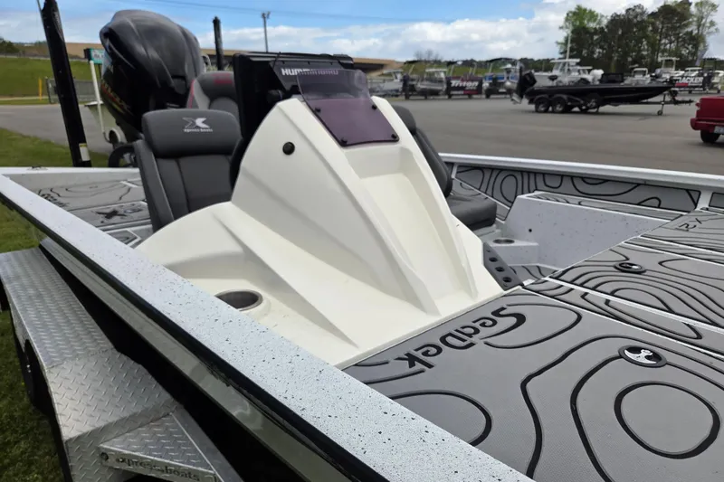 Slide: The Image of 2021 Xpress X21 Pro boat with sleek design and modern features, parked outdoors. - 9